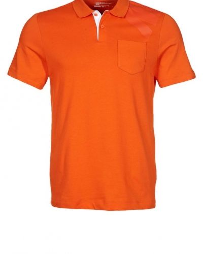 Nike Golf Nike Golf POCKET POLO Piké Orange. Traningstrojor håller hög kvalitet.