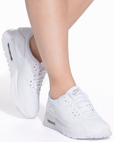 Till dam från Nike, en vit sneakers.