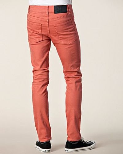 Till herr från Cheap Monday, en röd slim fit jeans.